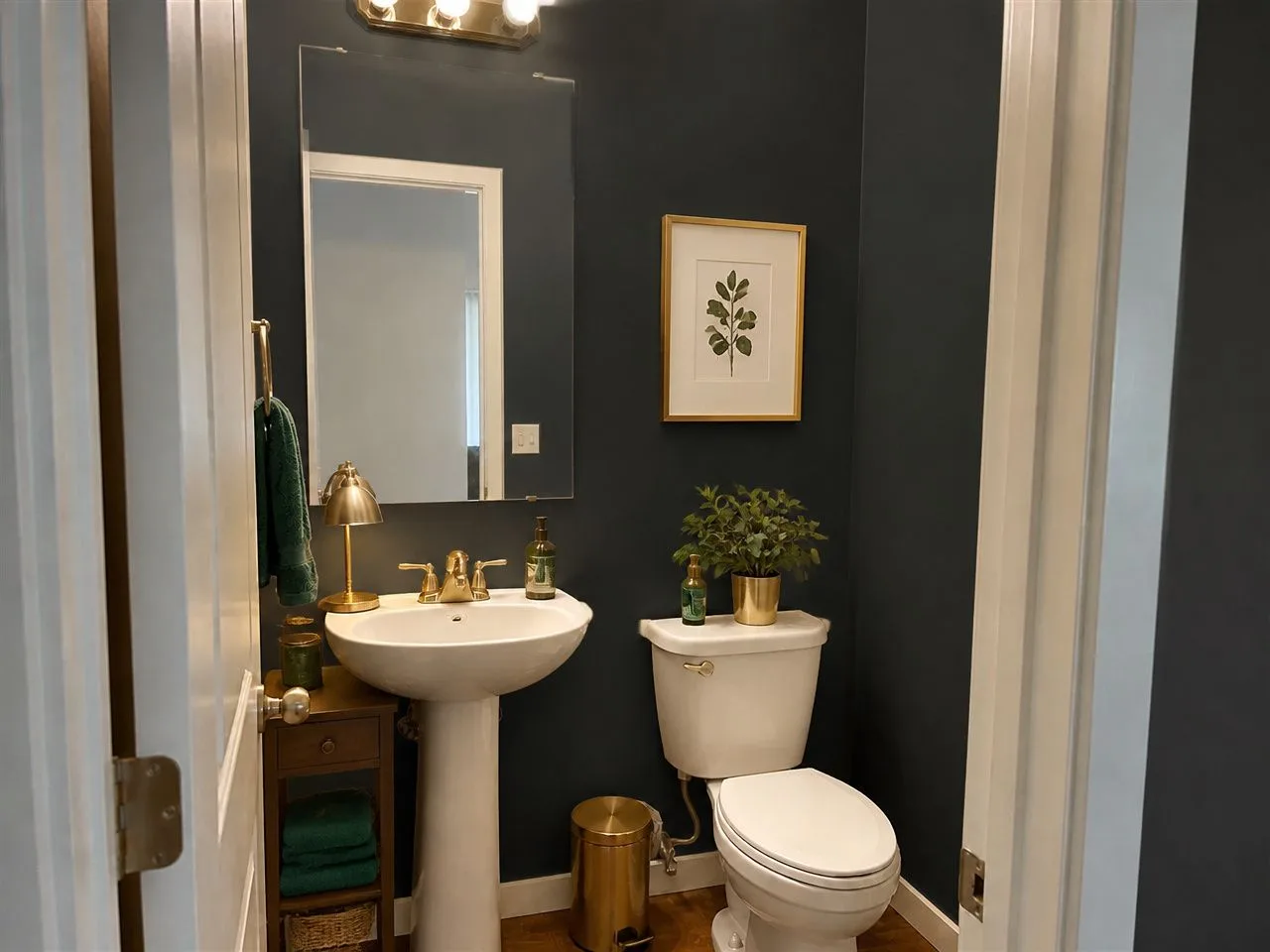 The same powder room redesigned in the free Velvet Nightfall style with dark walls and brass